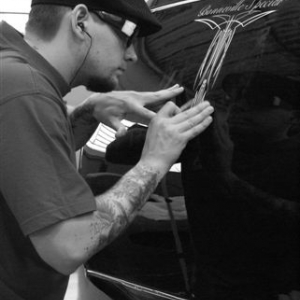 I forgot the name of the guy, but he makes some fine pinstriping and nowadays he lives in USA. 
Good luck, pal!