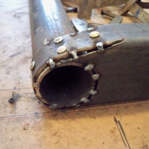 Forming front frame area with look like rivets..tack welded