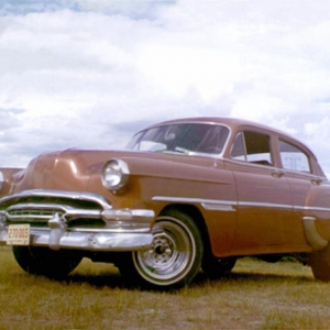 The 1954 Pontiac (Canadian) DeLuxe my dad gave me when I learned to drive (1965).  Had some mild customizing done and gave it a new paint job (1969)... then passed it on to my younger brother.  I always felt the hood was a work of art when it was done (ask someone with a Pontiac hood!).