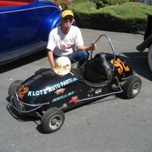 This is the '56 kurtis 1/4 midget that Jack drove to the B modified National Championship in 1957. The car is now owned by John Gunsaulis of Spokane, Washington, and other than the blue lettering, is exactly as it was in 1957! That's the helmet Jack wore in '57 sitting on the car. We met john in Plesanton in August, 09 for a reunion with the car. Jack presented John with the helmet.