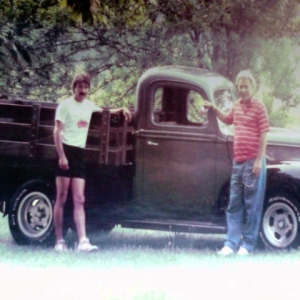 Photo 3  My 1941 ford factory flatbed,this photo is 27yrs .old and I still got her. Daddy and me.