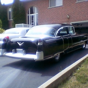 From the Back ... 55 year old Cadillac and new Town Car ... specifications very close after all those years ... wheel base, track, weight, HorsePower ... most options available ... then & now ...