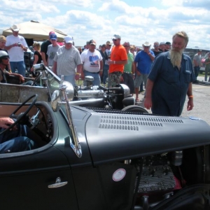 Dude doing his best Bo Huff imitation as Rob Lee gets ready to pull on the strip to do battle with an awesome 34 Ford roadster--the 261 ,two-barrel nipped the built flatty in the 34 but was a great race!