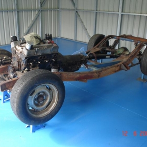 48 tudor frame in new shed: Using '47 Chevrolet Fleetmaster rails and custom-made cross members. 350 SBC and TH400.