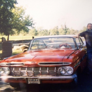 My dad next to my Impala.