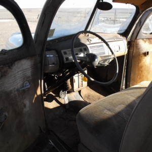 drivers interior, barley a tear in the old front seat, the radio works too! it all needs reupolstered but it is fully intact