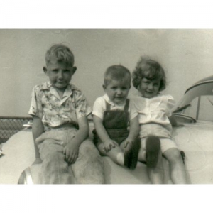 On Car Hood:    
My brother, me, my sister at 9-2-6 year's old about 1955