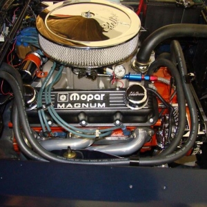 Mopar Performance 360 with 1 5/8 headers, Electronic ignition and dual field 75 Amp alternator.