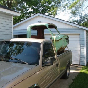 Finally Bringing the Cab To my place.
It took a Wild Ride off of its Resting place at the Farm when a Big gust of Wind blew it off the Frame.
Put a couple nice Debts in the Roof...I figured that was a sign it wanted to come home.