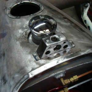 Fuel Filler And Bracket For The Headrest