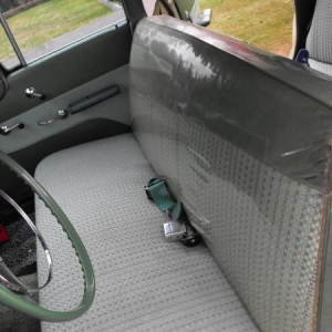 Front seat with original plastic still on the seats