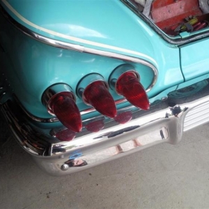 The lenses on the car before starting the job. These were held on with some thin aluminium pieces to "get the job done" many years ago.