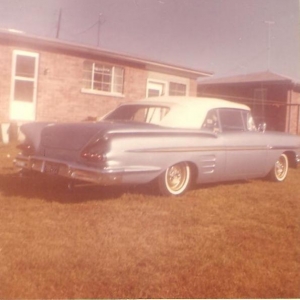 This was taken in 1964. The car was painted 1960 Cadillac Hampton Blue. Gold was painted in the side trim insert. All of the side mouldings (except the main trim) was removed. Doors, hood and trunk were all shaved. Wheels at this time were gold painted stock with spiders. Taillights were cut down 59 Cadillac.