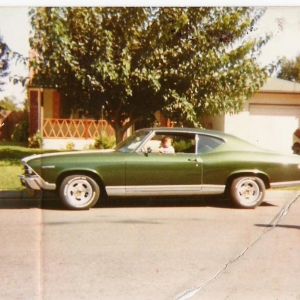 My Chevelle from high school with my son sitting in the window