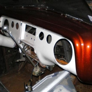 this was nicely done by the other owner, but not well placed...to tall for the car..so i put the stock one back in with a fillled radio delete...like my dad had it. i also installed a brand new slimmer tilt column...