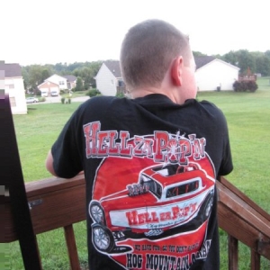 Got a free T shirt by being on the fence during a burnout. Don't know his name but his Dad said he was big shit in the neighborhood when he got home so that's what he's known as in the shop.