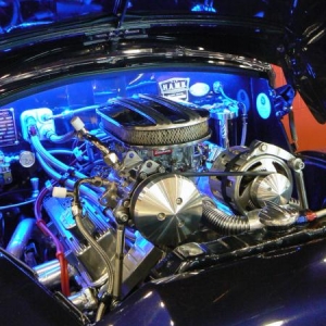 350 Chev crate engine stuffed into the engine bay of a small English sedan........