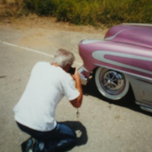 Picture 066
 Watson photographing his original wheelcover from the Grapevine which he sold in 1958..1998 at Paso...40 years later