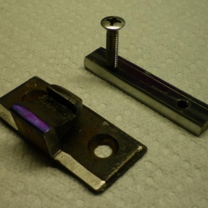 latch catch and nut plate. holes in door are reamed to 1/2 and nut plate makes it easy to adjust.