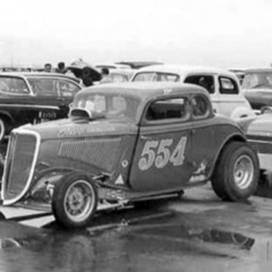 Waiting out the rain at the March Meet. The push truck is Gene's Ranchero that was painted to match the coupe. Classy!