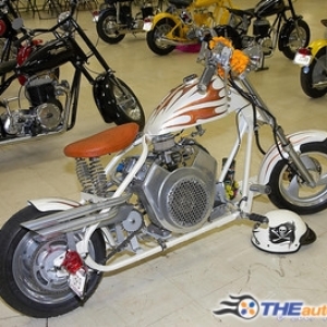 pops chopper cushman.. I laid the base and clear and buddy did the graphics... 3 part white perarl