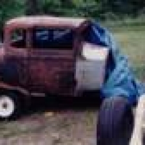 here it is after getting it home from N.H. $275 later, doors rootted so bad you could see through them no floors,rocker panels or interior of any kind. did come with a 29 Model A Door though.