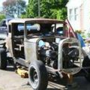 got me a Model A radiator shell 4 $25. mounted where i thought the 1969 Lincoln 460 mtr should be, but i ended up moving it about 5 times till it stayed in place.