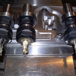 Header Flange Tormach Tooling System Milling Holders with the Cutters used for the milling operations.