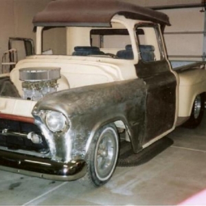 shaved door handles, modified '57 grille bar with fender lights removed