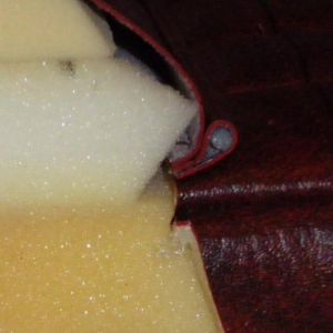 welt hold down and stacking for roll on front of seat