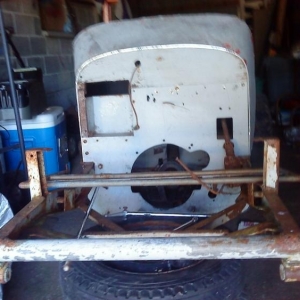 It was being used as a trailer, with a 2x4 stuck across it to hold a front wheel jack. The front bar has been replaced with a round bar, looks like the PO was going for a suicide front end.