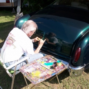 Ron Myers placing a tattoo