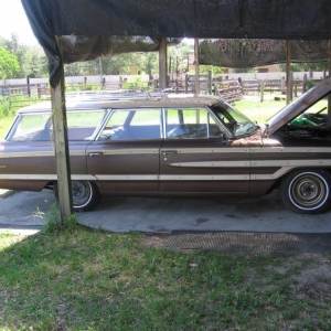 Tinkering on the electric choke wire to the dash. Needs wheels desperately 14x6 with factory Poverty caps is not my style. Astors / Reverse chrome steelies 7's and 8"s 225-70 frt. 275-60 rear. Or factory wide steelies same as the reverse chrome steelies. Decisions decisions????