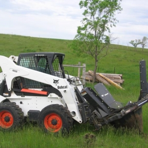 Transplanting spruce trees to hunting lodge.