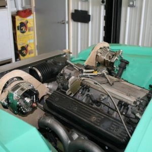 Another view of the mocked up AC and alternator mounts. Gives a view of the Speedway Motors Tru-Ram headders. These are nice units, I'd recommend them, good clearance all around.