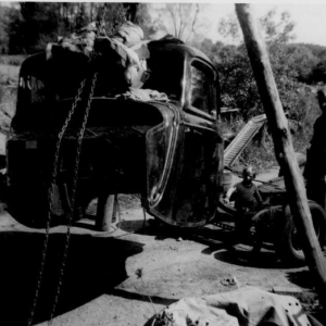 could this be the car i just got ???? the drilled dropped axle in the car as well as the fact that the driver door handle is messed up and is just the steel core without the chrome outer cover along with the stock aluminum head 21 stud next to it and the time frame make it very possible that this photo of Al working on the old ford is in fact a pic of my current ride !!!