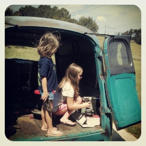 My girls removing screws from the panel truck.