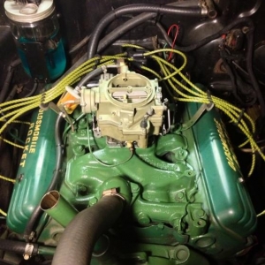 After a little clean up.  A freshened up fantastic carb rebuilt from Ross Racing Engines.  Some braided cloth plug wires from thehotrodcompany.com cut and crimped by me.  She's looking good :)