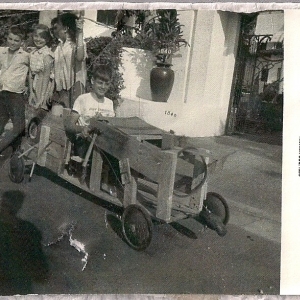 Photo was in camara for a time befor being develiped,but this was our own "OUR GANG" push car from early 50's,Thats me driving and my super fast motors standing behind,Pete Shaifer,my sis Gail,and Patty Duffer