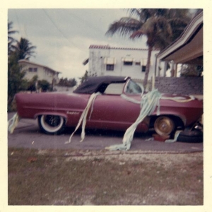 About 1961,Henry J top up,55 thunder bird top on my "J" with 53 study rear window as front windshield and a hell of a lot more custom work as well,I was working a new pair of front tires,my girlfrenid at the time had papered it for me the nite before when I was at the races,ha ha on me right,cus I didn't take her.