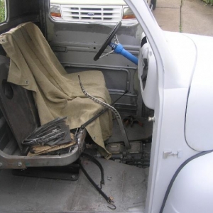 Cut down seat frame and pedestals from a full size late model Ford window van. Shift handle was made from an old wrench found in my Father-in Law's back yard.