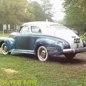 my 41 buick on a damp foggy spring morning - has a cool old picture feel to it .