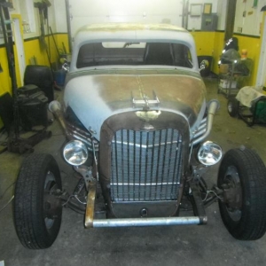 37 ford Grille shell with golf club shaft inserts and olds Rocket hood ornament