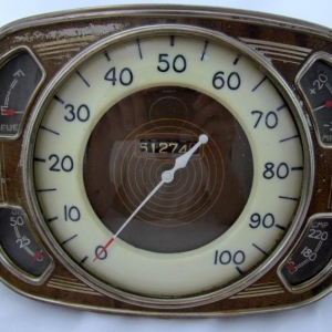 A beautiful 1934-35 LaFayette gauge panel.  Very stylized with a great faux wood surround.