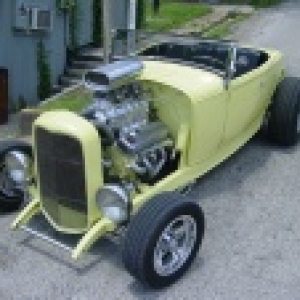 My 31 roadster with 32 firewall, 32 windsheile frame and posts, 32 frame with rear of body raised to clear stock 32 gas tank.