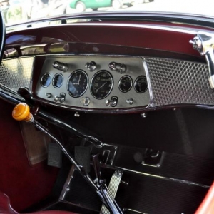 Incredible dash in a late twenties cadillac roadster.  Beautifully styled with the engine turned dash, oxblood red leather upholstery, rubber floor mat held in place by nickle plated trim and the slightest pop of color from the butterscotch shift knob.