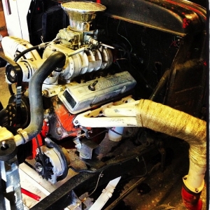 355 with a 144 supercharger  check out the fire wall that was cutout and moved 6''back the motor was pushed back 4''