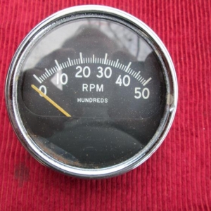 Strange electric tachometer, the font is very close to early Stewart Warner gauges.